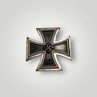 An original Iron Cross EK1 1939 By B.H. Mayer, three-piece construction with magnetic iron core.