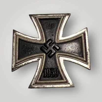 An original Iron Cross EK1 1939 By B.H. Mayer, three-piece construction with magnetic iron core.