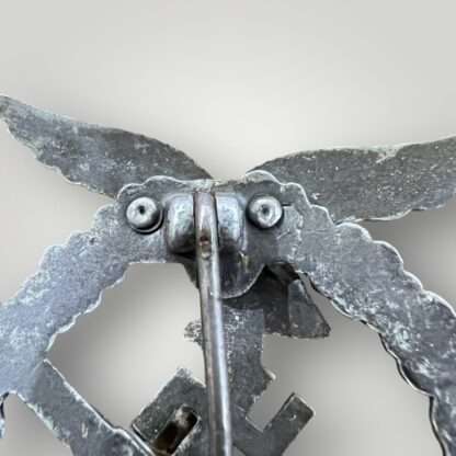 Reverse image of a Luftwaffe Flak Badge, with integral hinge by GWL.