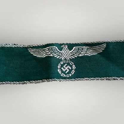 WW2 German customs border police cuff title, machine embroidered on green rayon material.