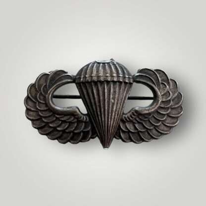 A US Army WW2 Paratrooper Jump Wings, die stamped construction with horizonal pin and catch.