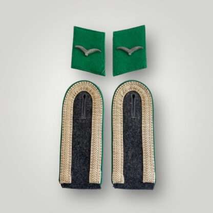 A group of WW2 Luftwaffe Felddivision insignia including a pair of shoulder boards for an Unteroffizer and collar tabs.