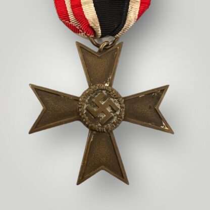 War Merit Cross 2nd Class without swords and ribbon, constructed in tombac die-struck with a bronze wash.