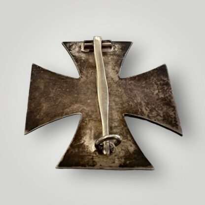 A reverse image of an early Schinkel Iron Cross 1st Class 1939 was produced by Schauerte & Hohfeld, featuring a three-part construction, non-magnetic with nice blackened factory finish with a nice patina