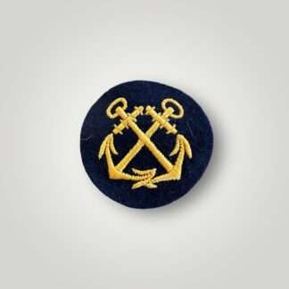 An original WW2 Kriegsmarine EM coxswain sleeve badge, machine embroidered with golden-yellow thread on dark blue wool backing.