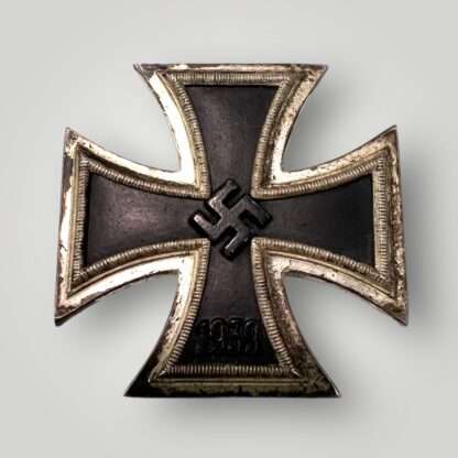 An original Iron Cross 1st Class by Wächtler & Lange, with a nice blackened core and ribbed border, with the raised swastika in the centre with institution date 1939 below.