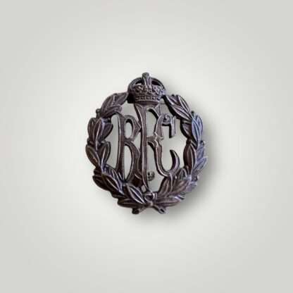 A British Royal Flying Corps officers collar badge manufactured in bronze, with the monogram 'RFC' surmounted by a King's crown and surrounded by a laurel wreath.