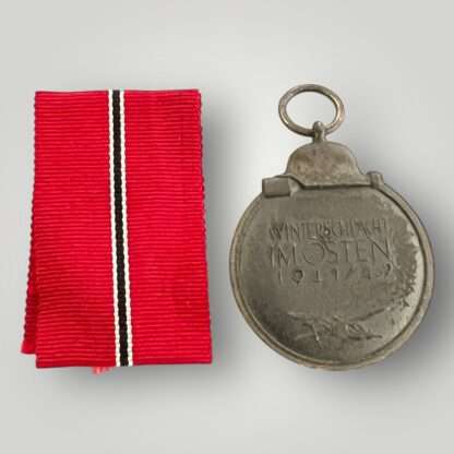Reverse image of German WW2 Eastern Front medal marked "127" on the medal ring attributed to the following manufacturer Moritz Hausch of Pforzheim.
