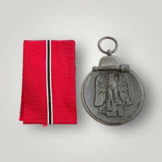 A German WW2 Eastern Front medal marked "127" on the medal ring attributed to the following manufacturer Moritz Hausch of Pforzheim, with original ribbon.