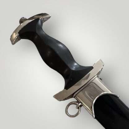 Reverse image of an SS Dagger wooden handle, crossguard, and nickle fittings.