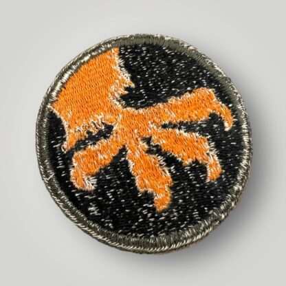 Reverse image of a US WW2 17th Airborne Division Patch, machine embroidered in gold and black thread, with a green rim.