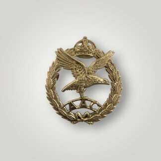 A British WW2 Army Air Corp Cap Badge with a voided crown, die-stamped in white metal.