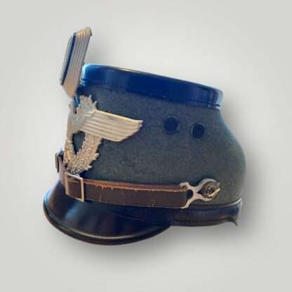 A German WW2 Polizei Gendarmerie NCO Shako 1936 pattern. The shako is constructed in molded, black vulcan fibre body with green wool.