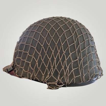 An orginal US WW2 Schlueter M1 Combat helmet, the shell is constructed in steel painted olive drab complete with cammouflage net.