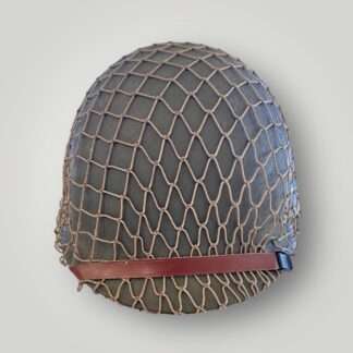 A US WW2 Schlueter M1 Combat helmet, the shell is constructed in steel painted olive drab complete with cammouflage net.