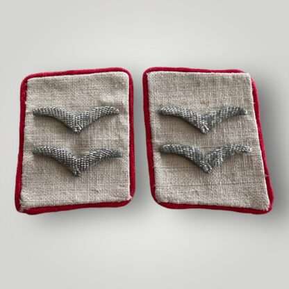 An orginal set of WW2 Luftwaffe “Hermann Göring” Flak Field Division collar tabs, contructed on white wool with red piping with two aluminium guls.