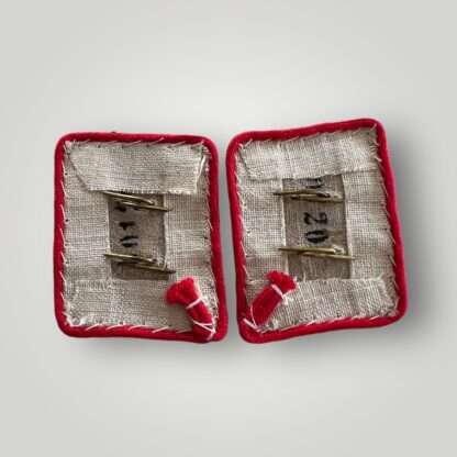 Reverse image of WW2 Luftwaffe “Hermann Göring” Flak Field Division collar tabs, contructed on white wool with red piping with two aluminium guls.