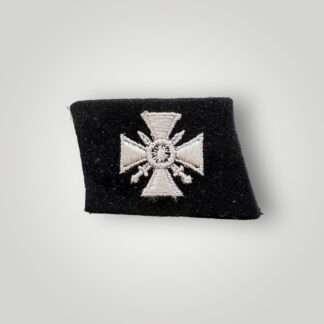 A textbook example of a Waffen-SS 29th Grenadier Division (Russian Volunteers) collar tab, machine embroidered in white thread on black woollen backing.