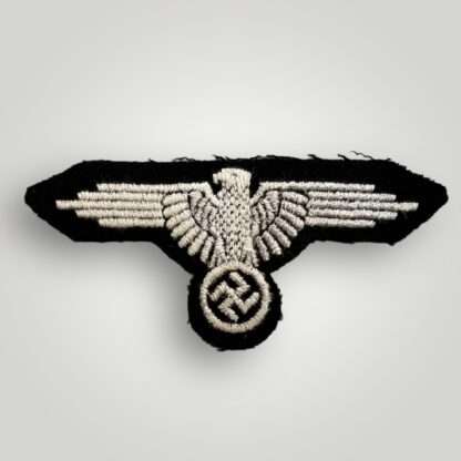 A Waffen-SS EM/NCO's Sleeve Badge, machine embroidered with silver grey thread on black wool backing.