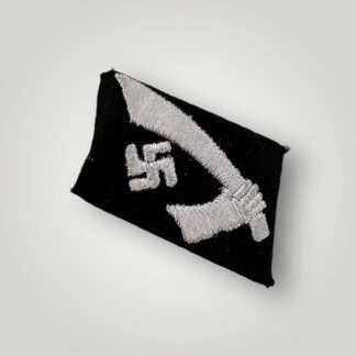 A 13th Waffen-SS Mountain Division Handschar collar tab, embroidered with silver-grey thread on typical SS black wool.