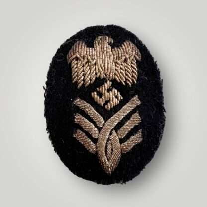An original Kriegsmarine High Grade Administration Official's sleeve badge, hand embroidered in silver bullion.