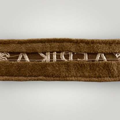 Reverse image of an original WW2 German Afrika Korp Officer's cuff title machine embroidered constructed in camel hair.