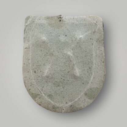 Reverse image of an Heer Kuban shield, die stamped construction in bronze complete with field grey woollen backing.