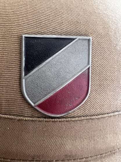 A close up image of a National tri-color shield.