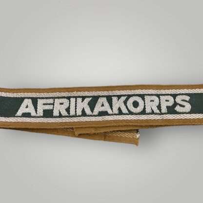 German Heer AfricaKorp WW2 Cuff Title, machine embroidered with silver aluminum wire, with the inscription AFRIKAKORP.