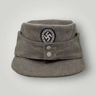 M43 Schutzmannschaft Officer’s Field Cap, constructed in grey field grey wool with aluminium wire piping running around the top of the outer edge of the crown.