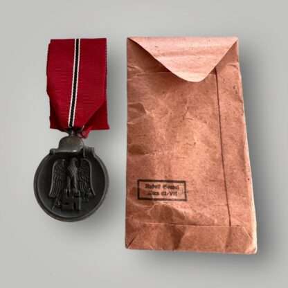 Reverse image of a Eastern Front Medal Rudolf Souval with presentation packet, constructed in zinc with long original ribbon complete with presentation packet which has the makers mark on the reverse of the packet "Rudolf Souval Wein 62/V11.