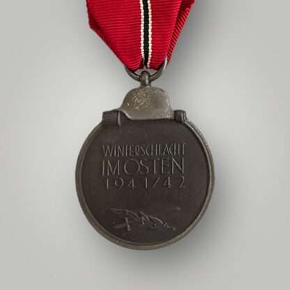 Eastern Front Medal which is embossed "WINTERSCHLACHT IM OSTEN 1941/42" (Winter Battle in the East 1941-42).