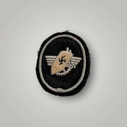 Werkschutz Factory Guard Officers sleeve badge, oval shaped badge hand embroirered in silver bullion wire on black felt backing.
