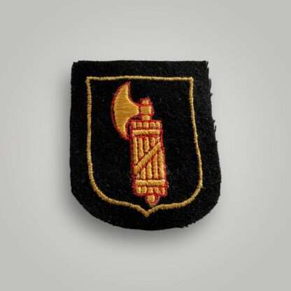 An SS Italian Volunteer Sleeve Badge, machine embroidered on red and yellow thread on black wool backing.