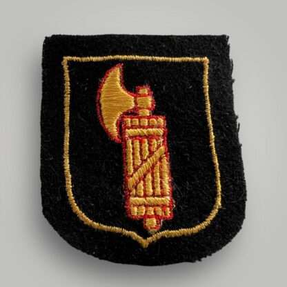 An SS Italian Volunteer Sleeve Badge, machine embroidered on red and yellow thread on black wool backing.