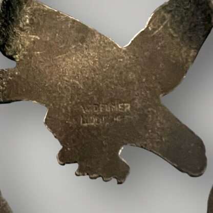 Reverse image of an original Luftwaffe Radio Operators and Air Gunner badge, two-piece construction in zinc.