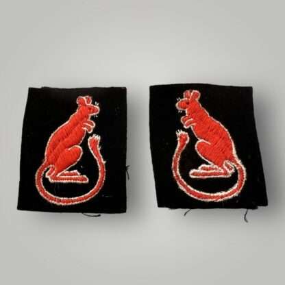 A set of WW2 British 7th Armoured Division 'Desert Rats' WW2 formation badges, machine embroidered and depicts the iconic red brown jerboa desert rat.
