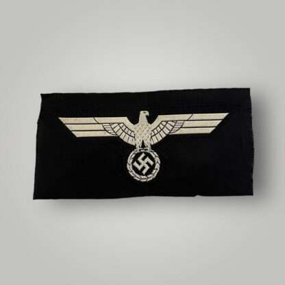 A Heer M40 Panzer Bevo Breast Eagle, flat wire Bevo construction woven in silver/grey thread on black rayon, unissued in good condition.