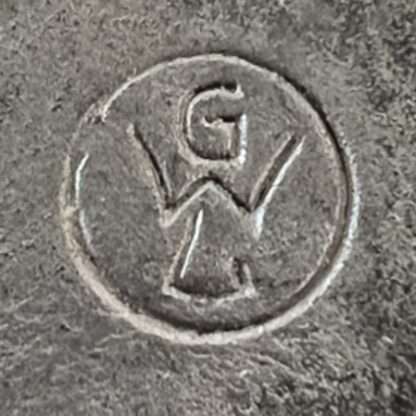 An original Luftwaffe Ground Assault Badge by GWL, die-stamped two-part construction in zinc.