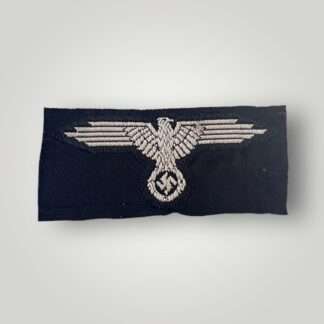 A genuine Waffen-SS cap eagle, BeVo flat woven construction in white thread on black rayon.