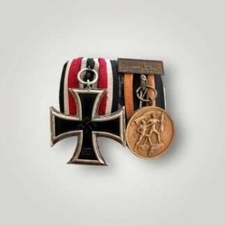 An early Iron Cross Schinkel EK2 With Sudetenland Medal & Prague Bar court mounted with nice wear.