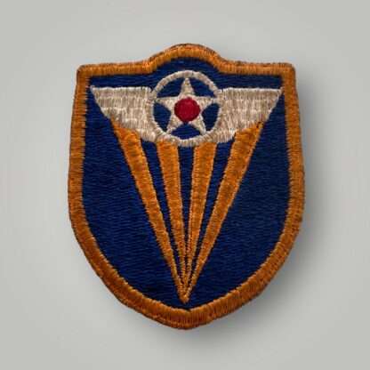 An orginal 4th USAAF WW2 patch, machine embroidered in red, white on blue backing. The patch depicts USSAF star with white wings with for yellow rayes eminating from the bottom of the insignia to the wings.