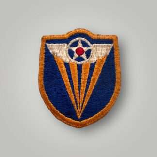 An orginal 4th USAAF WW2 patch, machine embroidered in red, white on blue backing. The patch depicts USSAF star with white wings with for yellow rayes eminating from the bottom of the insignia to the wings.