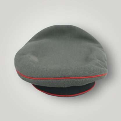 An early Heer Flak EM/NCOs Visor Cap By Wilhelm Wethekam, constructed with grey-green felted doeskin with three bands of red pipping for Flak/Artillery units with dark green woolen band for Army/Heer and leather chin strap.