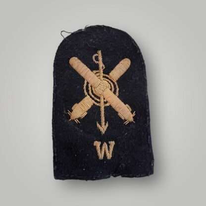 A Royal Navy WW2 Radio Underwater Weapon Rating trade badge, machine embrpiderd in gold on dark blue woo