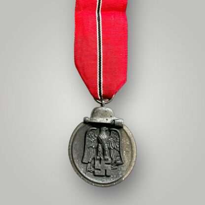 An original Eastern Front medal, constructed in zinc with nice long ribbon.
