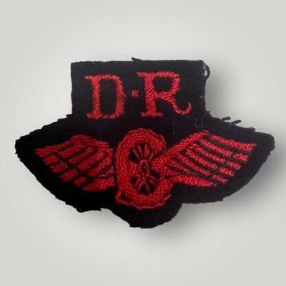 An original British Royal Marines WW2 Despatch Rider qualification badge, machine embroiarded in red thread on dark blue woollen backing.