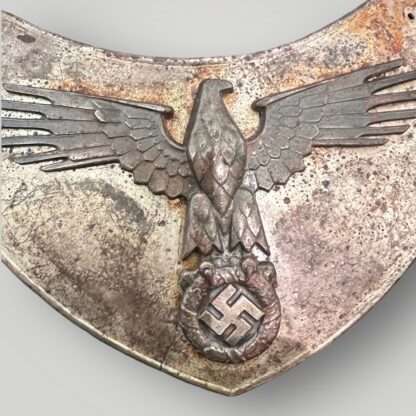 An extremly rare SS 1938 Flag Bearers Gorget relic, the body of the gorget is die stamped nickle plated brass with a dramatic Schutzstaffel eagle with splayed wing feathers and clutching a wreath and swastika in the centre constructed from tombak