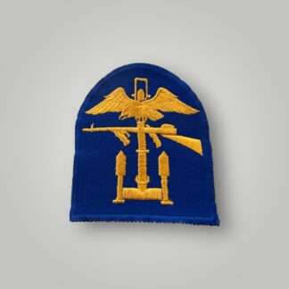 An original US WW2 Army Engineer Special Brigade insignia, machine embroidered in yellow and light blue thread.