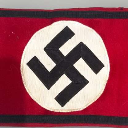 A rare original Allgemeine SS Armband With RZM Label 1933, three piece construction on red wool with black tress bordered running along the whole length on the armband above and below.